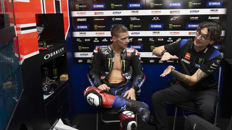 Fabio Quartararo with crew chief Diego Gubellini in MotoGP pit garage