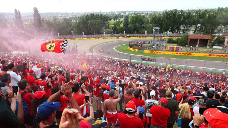 Max Verstappen and Lando Norris on track at Imola in front of a stand full of Ferrari fans